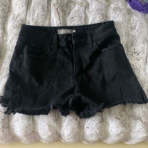 Black jean shorts. There is no rips and not too shot. Perfect length!